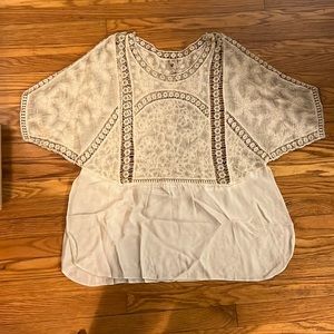 Cream colored tunic with lace panels